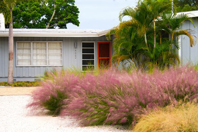 This is an example of a coastal full sun front yard landscaping in Portland for fall.
