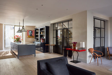 Inspiration for a large classic kitchen/dining room in London with brown walls, light hardwood flooring, no fireplace and brown floors.