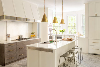 Design ideas for a beach style u-shaped kitchen in Portland Maine with white cabinets, white splashback, ceramic floors, with island, grey floor, stone slab splashback, stainless steel appliances and white benchtop.