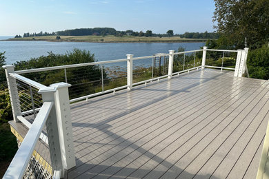Deck - mid-sized coastal backyard second story deck idea in Other