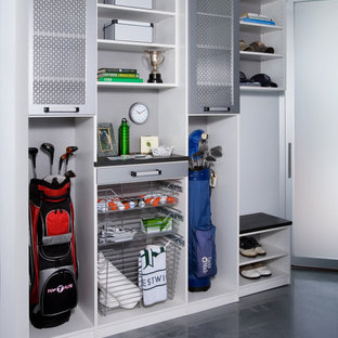 Design ideas for a medium sized modern attached garage workshop in New York.