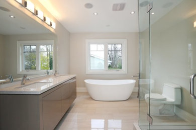 Bathroom - large contemporary master multicolored tile and ceramic tile ceramic tile and beige floor bathroom idea in Toronto with flat-panel cabinets, gray cabinets, an undermount sink, beige walls, a two-piece toilet, quartz countertops and a hinged shower door