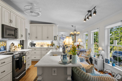 Kitchen - french country kitchen idea in Other with white cabinets, white backsplash, ceramic backsplash, stainless steel appliances and white countertops