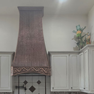 Warm Southwestern Kitchen with Copper Range Hood