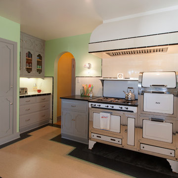 Linoleum flooring and a vintage Magic Chef 6300 stove set the stage for the kitc