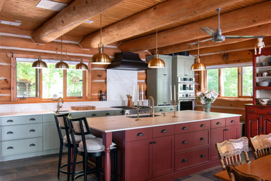 Inspiration for a large farmhouse galley slate floor and multicolored floor eat-in kitchen remodel in Ottawa with an undermount sink, shaker cabinets, red cabinets, quartz countertops, white backsplash, quartz backsplash, stainless steel appliances, an island and white countertops