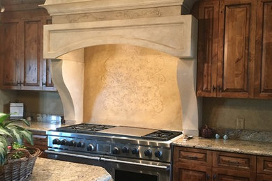 Example of a tuscan kitchen design in Dallas