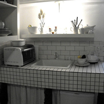 Small White tiled Baths & Studio Kitchen.