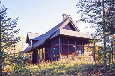 Inspiration for a rustic wood exterior home remodel in New York