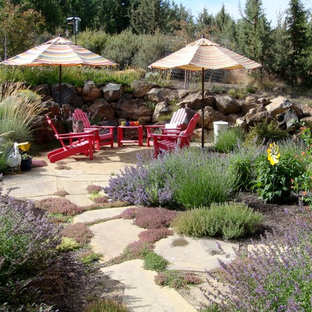 Inspiration for a mediterranean backyard patio in Other with decomposed granite.