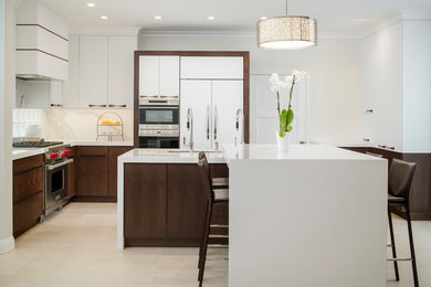 This is an example of a large contemporary l-shaped separate kitchen in Orange County with an undermount sink, flat-panel cabinets, dark wood cabinets, wood benchtops, beige splashback, marble splashback, stainless steel appliances, ceramic floors, with island and beige floor.