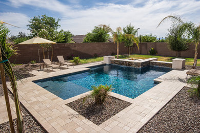 Hot tub - mid-sized traditional backyard custom-shaped lap hot tub idea in Austin