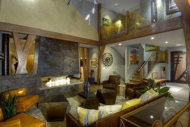 Example of a large transitional open concept medium tone wood floor living room design in Denver with gray walls, a two-sided fireplace and a tile fireplace
