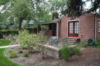 Small elegant front yard brick patio photo in Denver