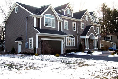Large traditional gray two-story mixed siding exterior home idea in New York with a shingle roof