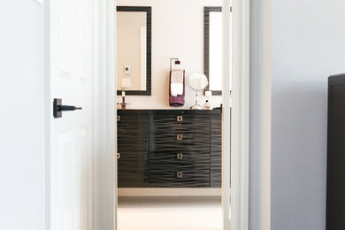 Walk-in shower - mid-sized contemporary master white tile and glass tile marble floor walk-in shower idea in Toronto with flat-panel cabinets, black cabinets, a one-piece toilet, white walls, an undermount sink and granite countertops