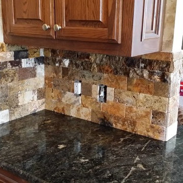 Scabos Split face tile backsplash with Cordoba Granite Counte Top