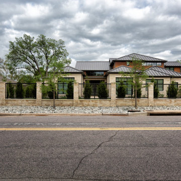 Custom Metal Fence & Electric Driveway Gate with Stone Accents