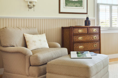 Mid-sized farmhouse master medium tone wood floor and brown floor bedroom photo in Boston with beige walls and no fireplace