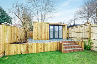 Photo of a contemporary detached garden shed and building in Surrey.