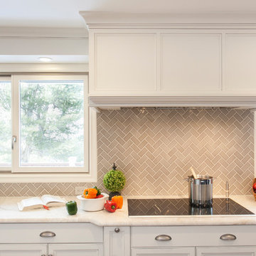Herringbone Patterned Backsplash and Custom Hood