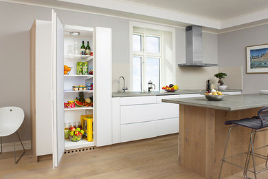 This is an example of a mid-sized contemporary kitchen in Other.