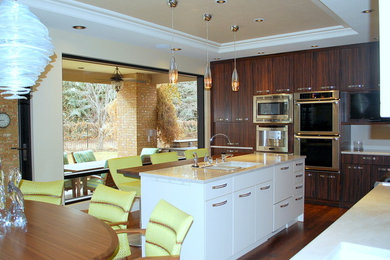 Large trendy medium tone wood floor kitchen photo in Denver with an undermount sink, flat-panel cabinets, quartzite countertops, beige backsplash, porcelain backsplash and stainless steel appliances