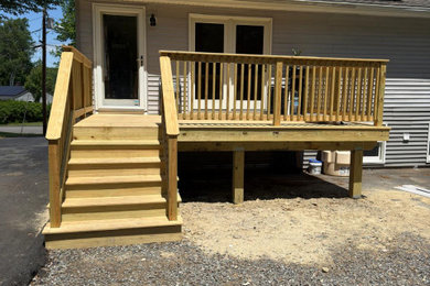 Mid-sized elegant backyard wood railing deck photo in Boston
