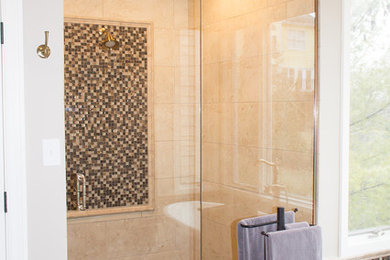 Inspiration for a mid-sized transitional master bathroom in St Louis with brown cabinets, a freestanding tub, an open shower, beige walls, beige floor and a hinged shower door.