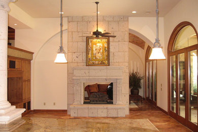 Large open concept terra-cotta tile living room photo in Houston with beige walls, a two-sided fireplace and a stone fireplace