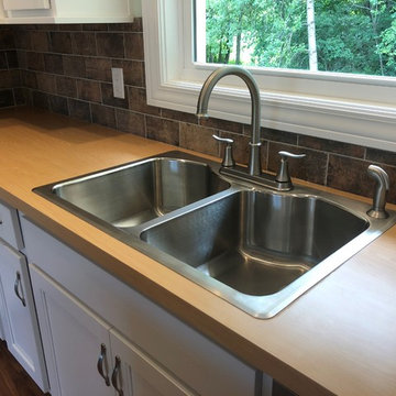 New Construction Milan, IL Koch Express Painted White Formica Amber Maple