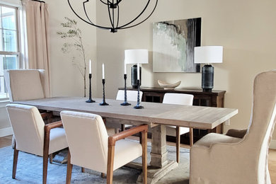 Large transitional dining room in Orlando with beige walls and beige floor.