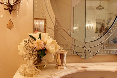 Example of a mid-sized classic master white tile and porcelain tile marble floor and multicolored floor double shower design in Los Angeles with raised-panel cabinets, medium tone wood cabinets, an undermount tub, a one-piece toilet, beige walls, an undermount sink, marble countertops, a hinged shower door and white countertops
