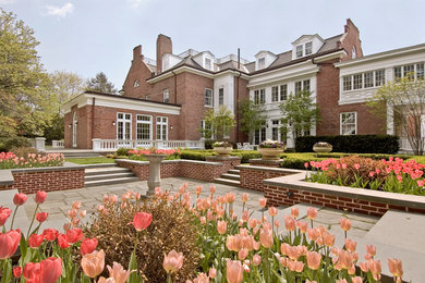 Large elegant red three-story brick exterior home photo in Boston