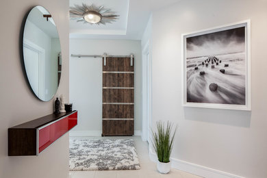 Large trendy porcelain tile foyer photo in Other with beige walls