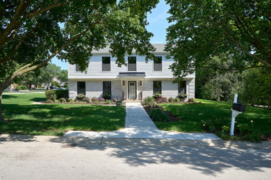 Example of a country home design design in Chicago