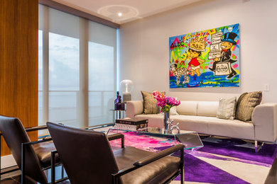 Example of a large trendy porcelain tile and black floor living room design in Miami with white walls, no fireplace, a metal fireplace and no tv