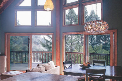 Inspiration for a mid-sized rustic loft-style medium tone wood floor living room remodel in San Francisco with green walls