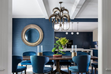 This is an example of a large contemporary kitchen/dining combo in Melbourne with blue walls, light hardwood floors, exposed beam and wallpaper.