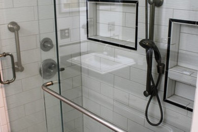 Inspiration for a small transitional master white tile mosaic tile floor and white floor bathroom remodel in Detroit with recessed-panel cabinets, white cabinets, a two-piece toilet, gray walls, a drop-in sink, quartz countertops and black countertops