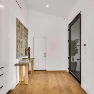 Hollywood Hills Minimalist Entry Hall with Natural Wood Floors