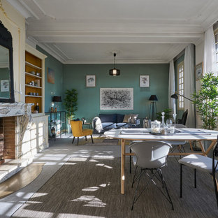 モンペリエの北欧風 LDKの画像 (緑の壁、カーペット敷き、標準型暖炉、石材の暖炉まわり、グレーの床)