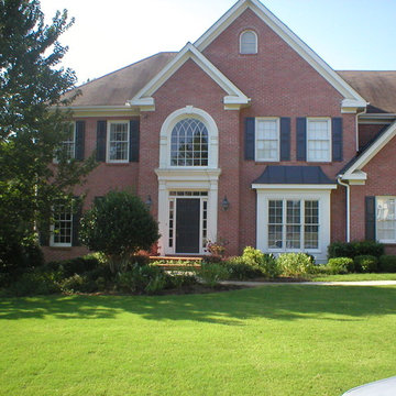 Double-hung windows and foyer palladium window with gothic grills.
