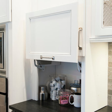 White Kitchen Cabinets with Appliance Garage and Honed Granite Countertop