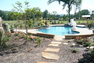 Inspiration for a large timeless backyard tile and custom-shaped lap hot tub remodel in Little Rock