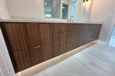 Trendy master single-sink bathroom photo in Dallas with flat-panel cabinets, brown cabinets and a floating vanity