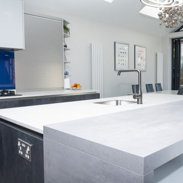 Handless Kitchen with Blue Splashback in Stanmore By Kudos Interior Designs