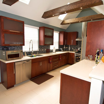 Cherry Wood Kitchen With Vaulted Beam Ceiling and Skylights
