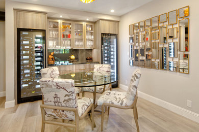 Mid-sized trendy galley vinyl floor and gray floor wet bar photo in San Francisco with an integrated sink, flat-panel cabinets, gray cabinets, solid surface countertops, black backsplash, porcelain backsplash and black countertops