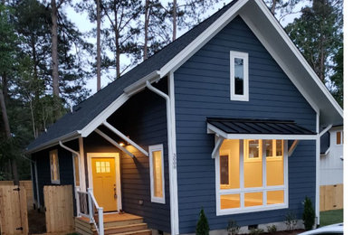 Inspiration for a mid-sized country blue one-story concrete fiberboard exterior home remodel in Raleigh with a mixed material roof